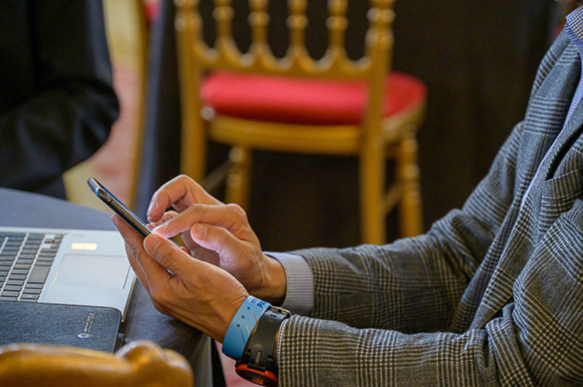 Business attendee using smartphone